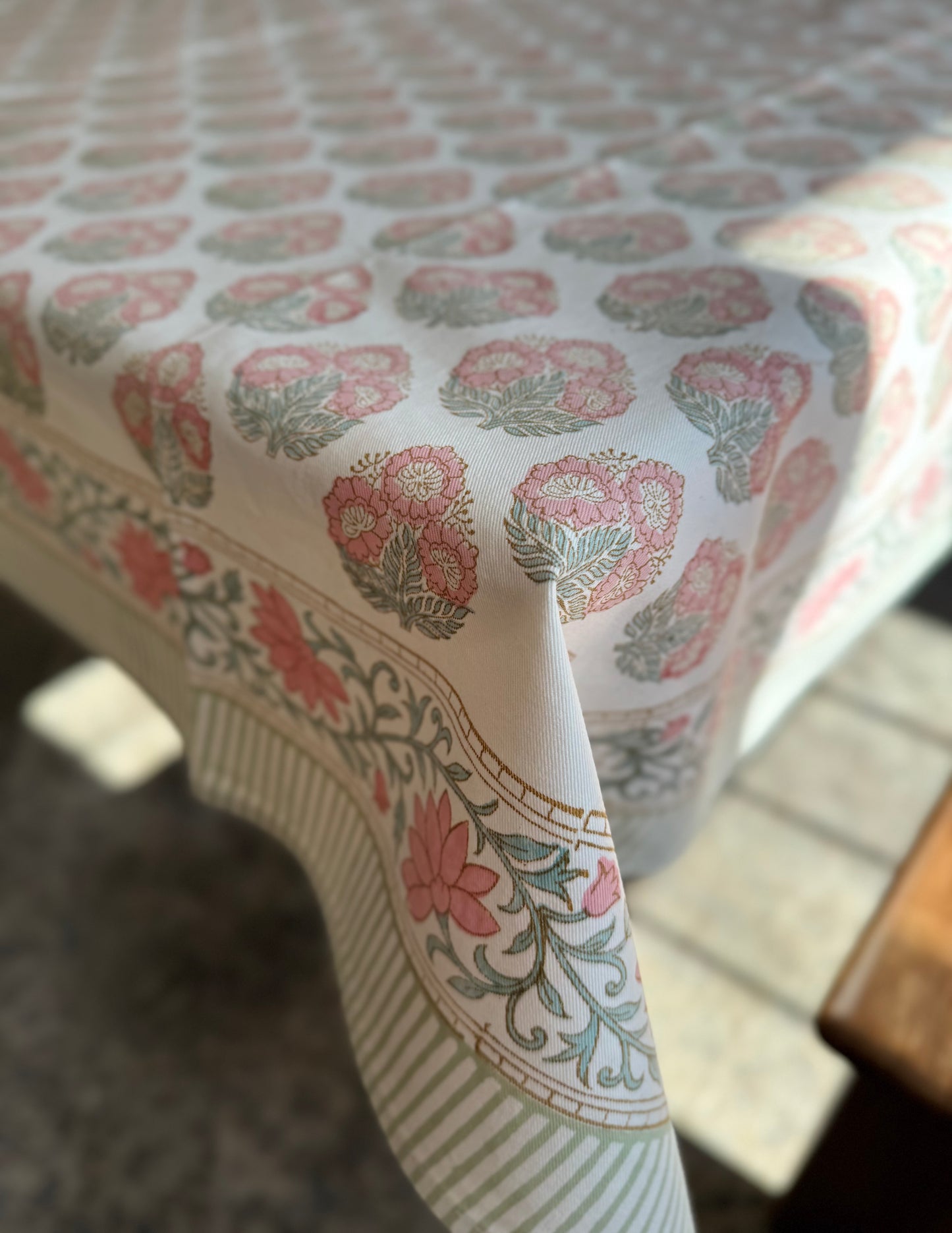 House of Mulmul - Blockprinted Cotton Table Cloth. Floral patterned cotton tablecloth on a wooden table