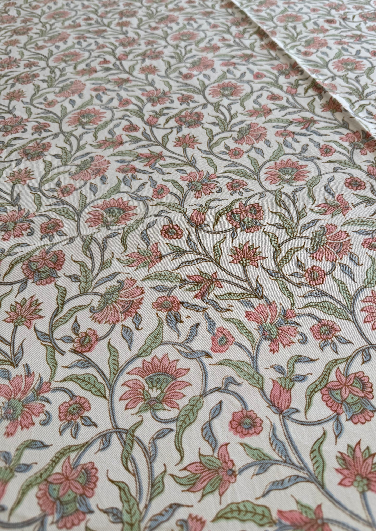 House of Mulmul - Blockprinted Cotton Table Cloth. Floral patterned tablecloth with pink and green flowers on a white background