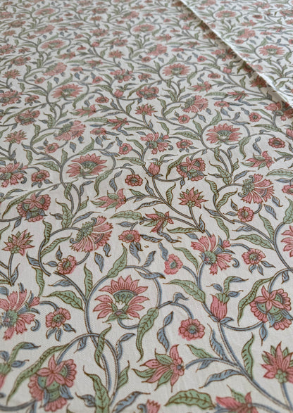 House of Mulmul - Blockprinted Cotton Table Cloth. Floral patterned tablecloth with pink and green flowers on a white background