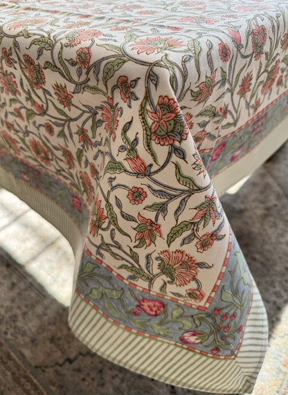 House of Mulmul - Blockprinted Cotton Table Cloth. Floral patterned tablecloth on a table with a textured surface