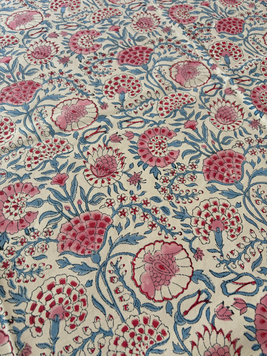 House of Mulmul - Blockprinted Cotton Table Cloth. Floral patterned fabric with pink and blue flowers on a beige background