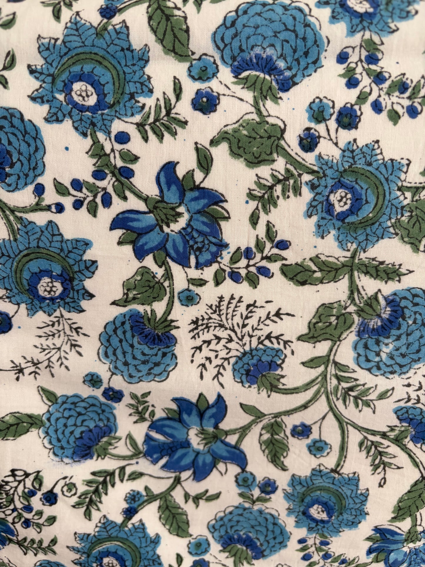 House of Mulmul - Blockprinted Cotton Reversible Table Runner & Placemats set. Close-up of blue floral pattern on a beige background