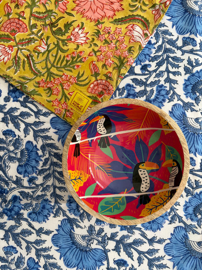 House of Mulmul - Blockprinted Cotton Reversible Table Runner & Placemats set. Decorative plates with floral and abstract designs on a patterned fabric background