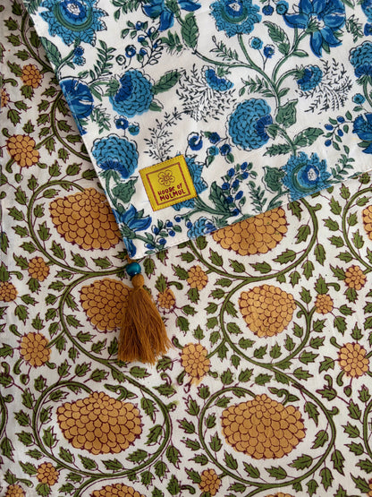 House of Mulmul - Blockprinted Cotton Reversible Table Runner & Placemats set. Fabric with blue floral and brown geometric patterns, featuring a 'Made in India' label.