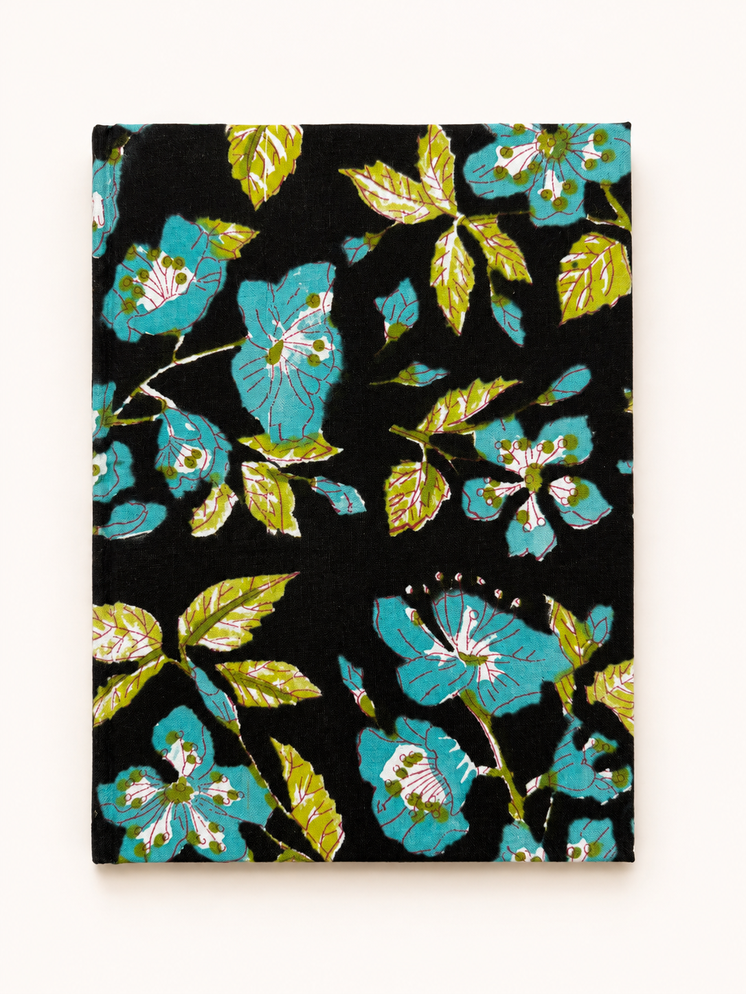 House of Mulmul - Blockprinted Journal Diary Notebook. A rectangular black notebook or journal with a vibrant floral pattern featuring turquoise blue flowers and olive green leaves, displayed flat against a light beige background.