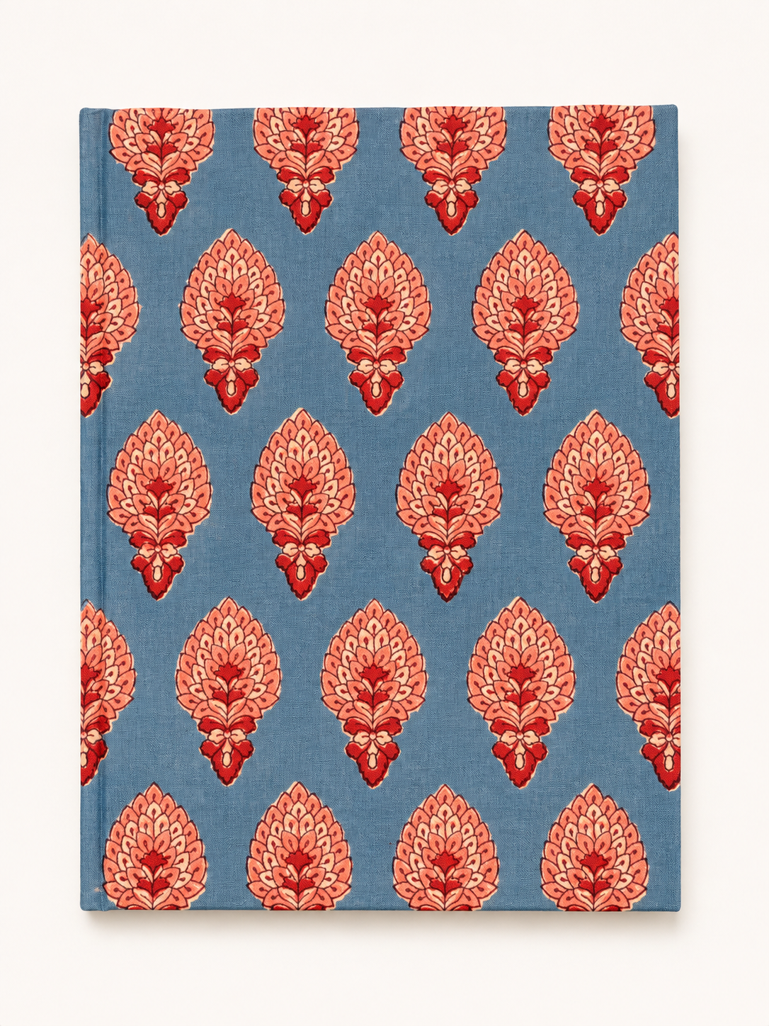 House of Mulmul - Blockprinted Journal Diary Notebook. A hardcover notebook with a blue cover featuring a repeating coral-red and pink floral block print pattern, shown against a plain off-white background.