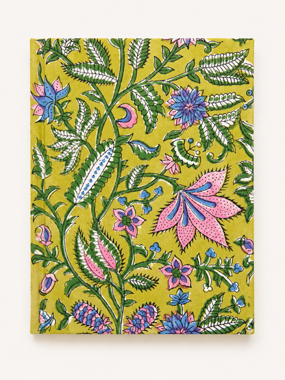 House of Mulmul - Blockprinted Journal Diary Notebook. A hardcover notebook with a vibrant, hand-painted style floral and botanical pattern on a mustard yellow cover, photographed flat against a clean off-white background.