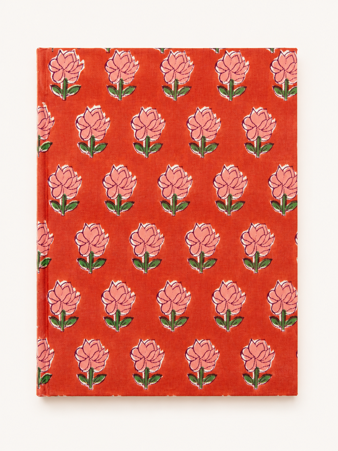 House of Mulmul - Blockprinted Journal Diary Notebook. A hardcover notebook with a vibrant orange-red cover featuring a repeating block-print style floral pattern of pink flowers with green leaves, shown against a plain off-white background.