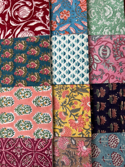 House of Mulmul - Blockprinted Journal Diary Notebook. A grid of twelve fabric or wallpaper swatches with various traditional block prints in multiple colors including red, blue, green, pink, yellow, and navy.