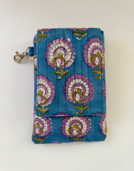 House of Mulmul - Blockprinted Mobile Sling Bag. A small mobile pouch or wallet with a blue base and a repeating floral print in pink, white, and olive green, featuring a silver metal clasp on the left side, photographed against a plain off-white background.