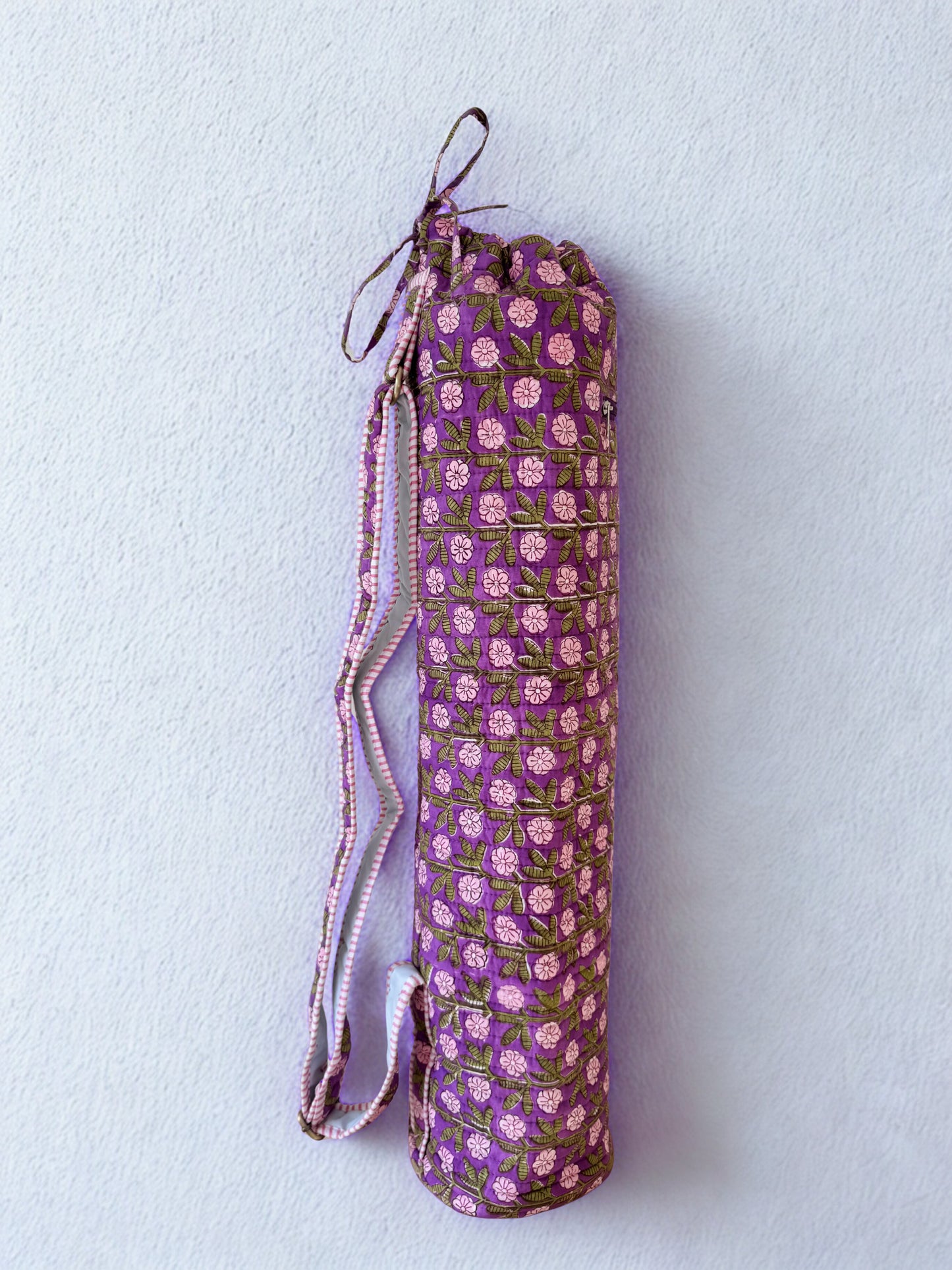 House of Mulmul - Blockprinted Yoga Mat Cover. Purple floral-patterned yoga mat bag on a light gray background