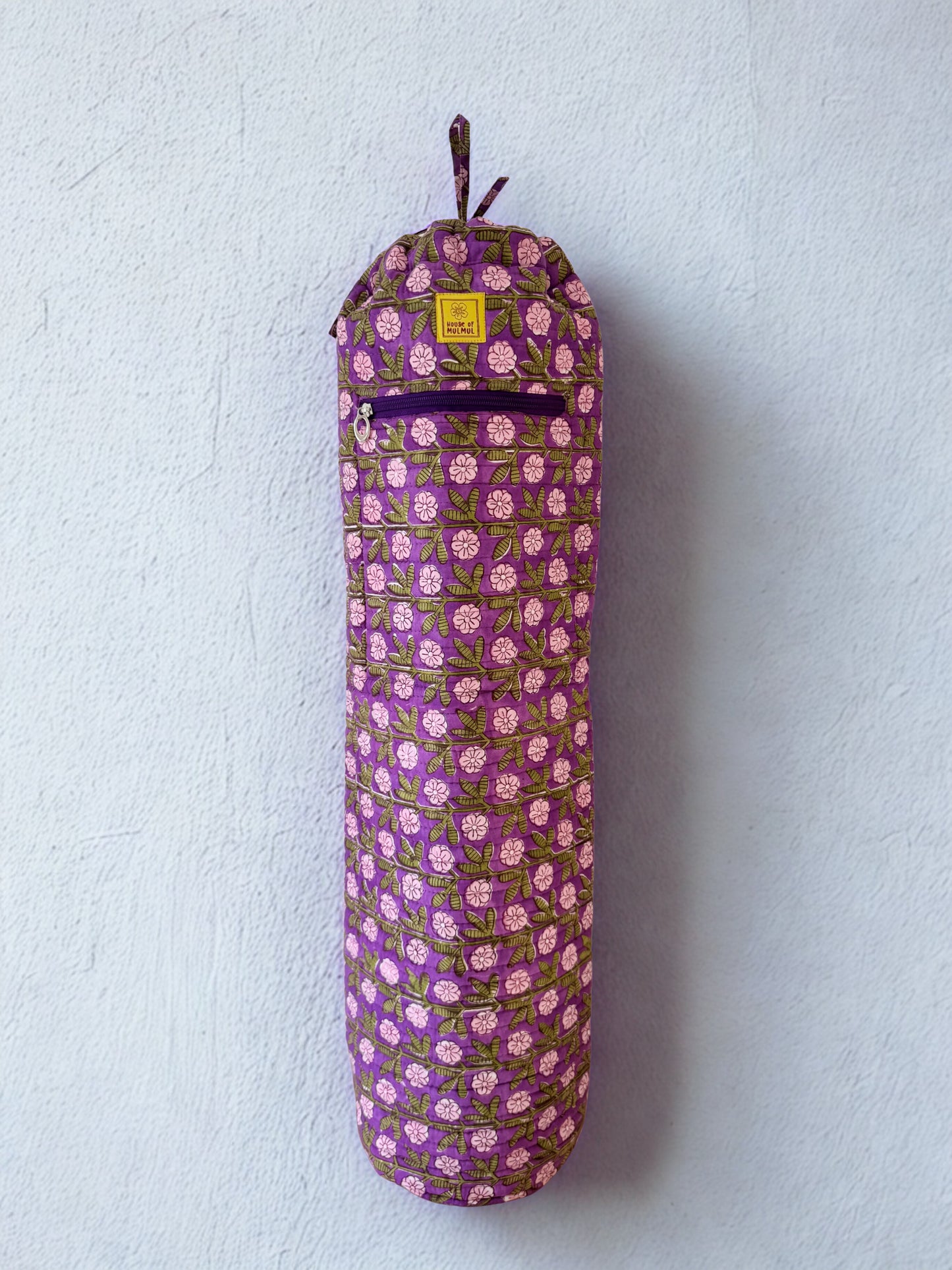 House of Mulmul - Blockprinted Yoga Mat Cover. Purple floral-patterned yoga mat bag on a light gray background