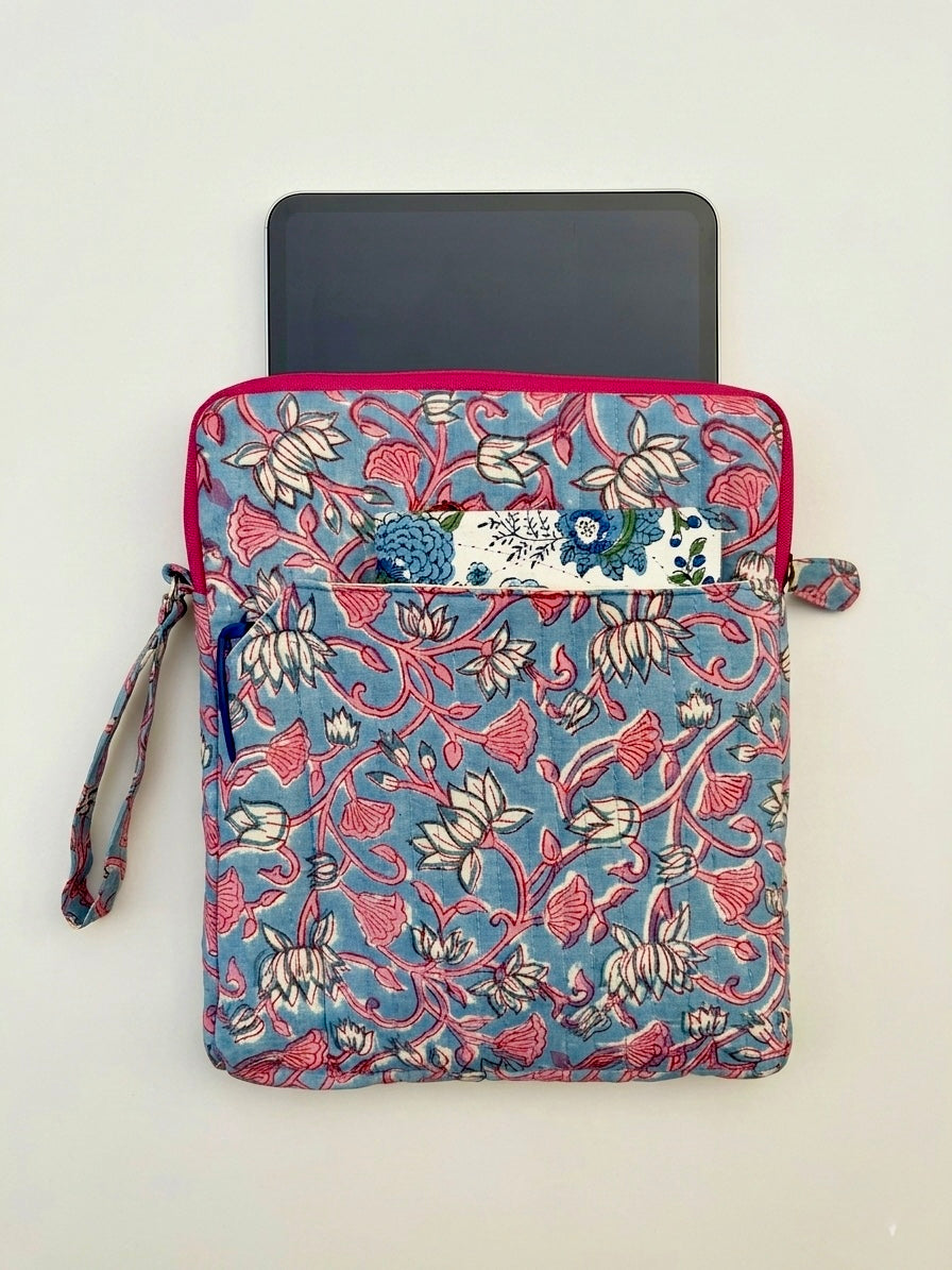 House of Mulmul - Blockprinted iPad Sleeve Cover. Floral patterned iPad sleeve cover with a diary in front and a wrist strap on a light beige background