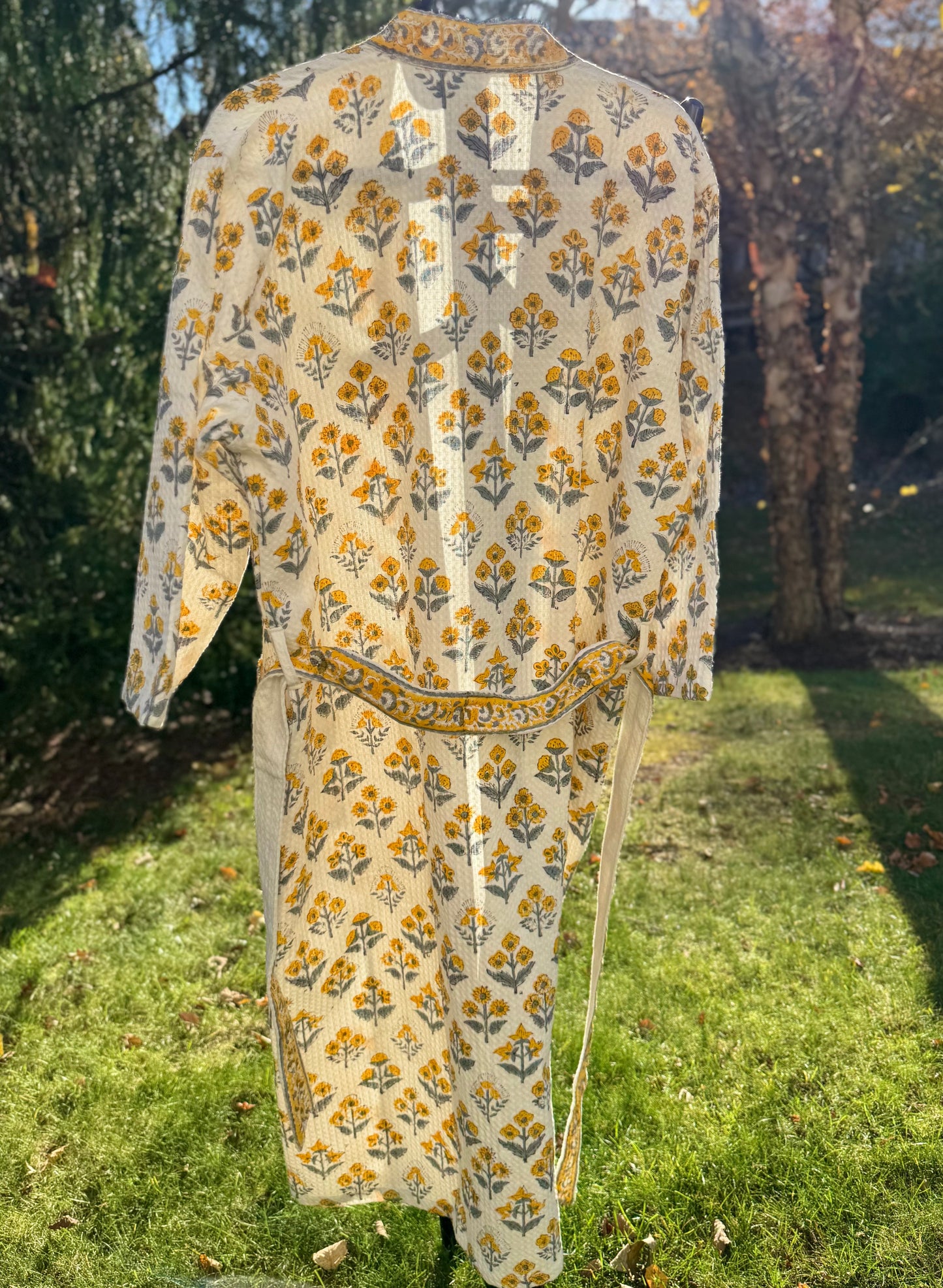 House of Mulmul - Cotton Bath robe. Floral patterned robe on a grassy background
