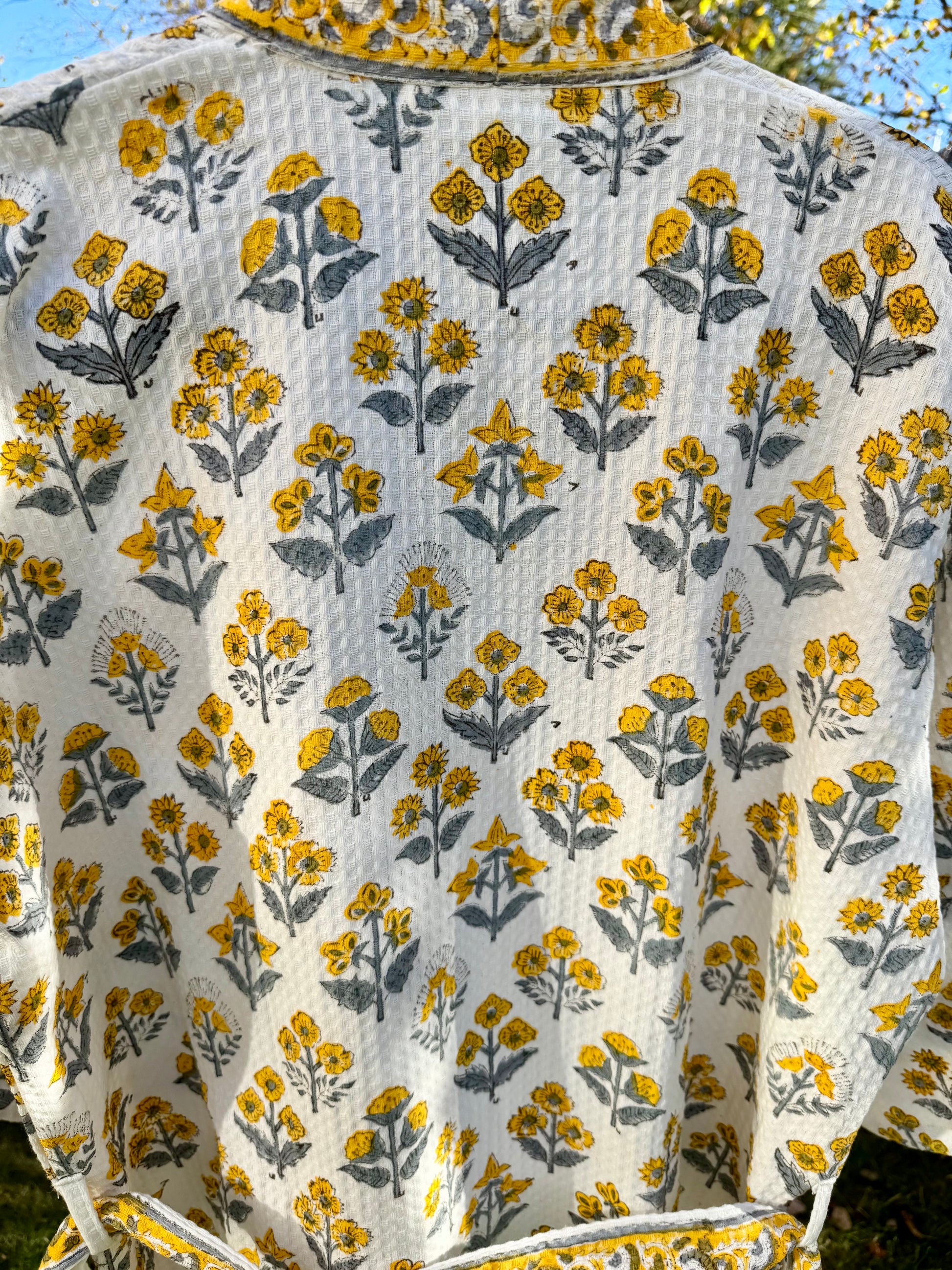 House of Mulmul - Cotton Bath robe. Floral patterned robe with yellow and gray flowers on a white background