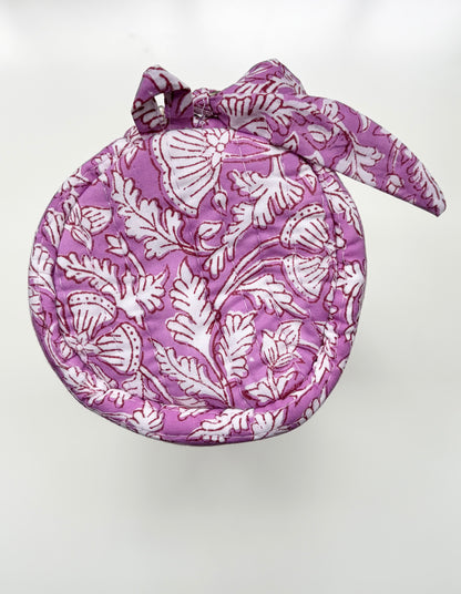 House of Mulmul - Cotton Quilted Makeup-Pencil Pouch. A round fabric headscarf or bonnet with a matching bow, featuring a white block-print style floral and leaf pattern on a purple background, shown against a plain white backdrop.