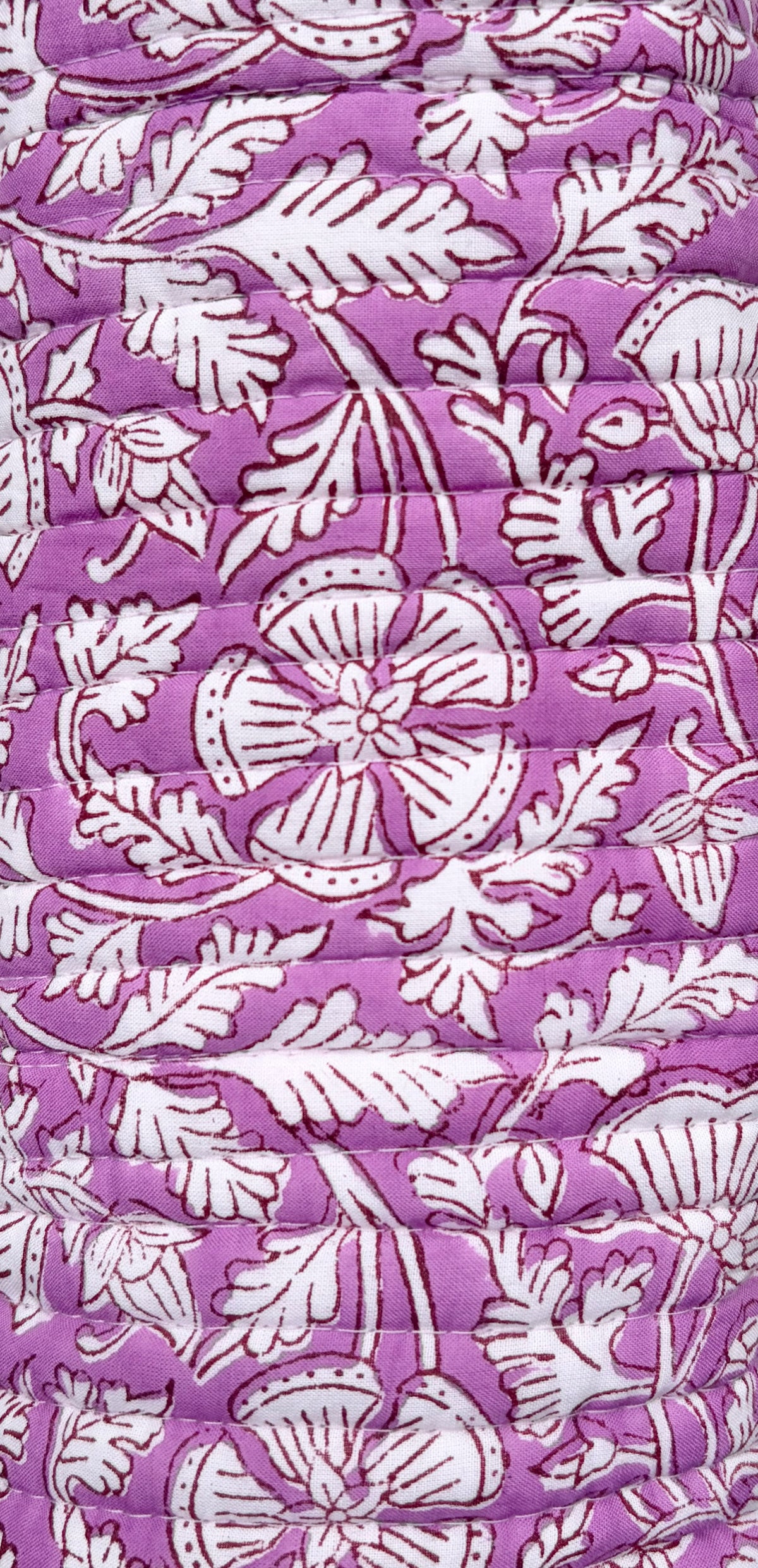 House of Mulmul - Cotton Quilted Makeup-Pencil Pouch. A close-up of a purple quilted fabric with a white floral and leaf block-print pattern.