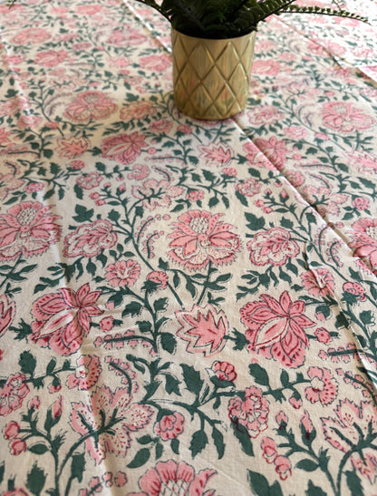 House of Mulmul - Cotton Table Cloth Round. Floral patterned fabric with pink flowers on a white background