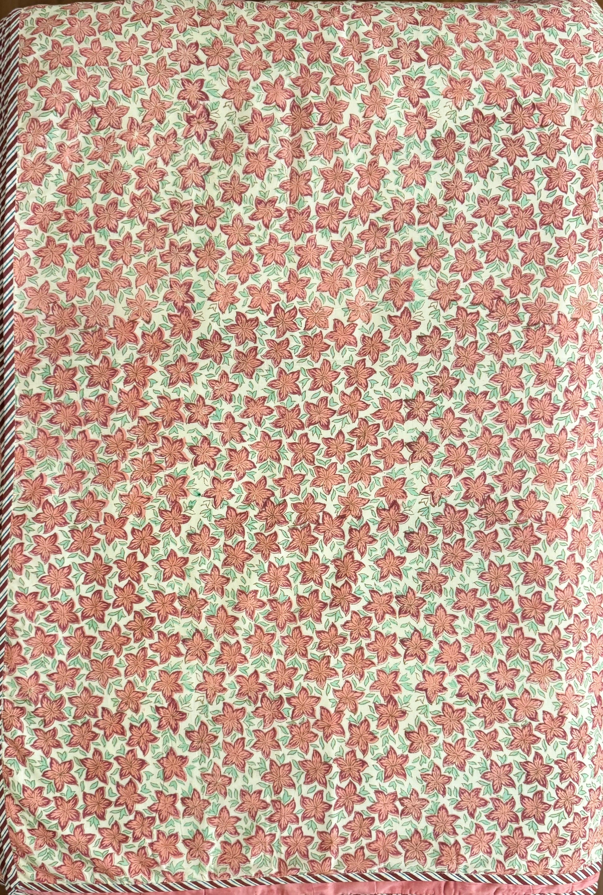 House of Mulmul - Coverlet Dohar, cotton blanket, muslin blanket, mulmul dohar. Patterned fabric with star design in pink and green