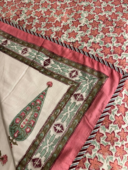 House of Mulmul - Coverlet Dohar, cotton blanket, muslin blanket, mulmul dohar. Close-up of a floral patterned fabric with a green leaf design on a white background.