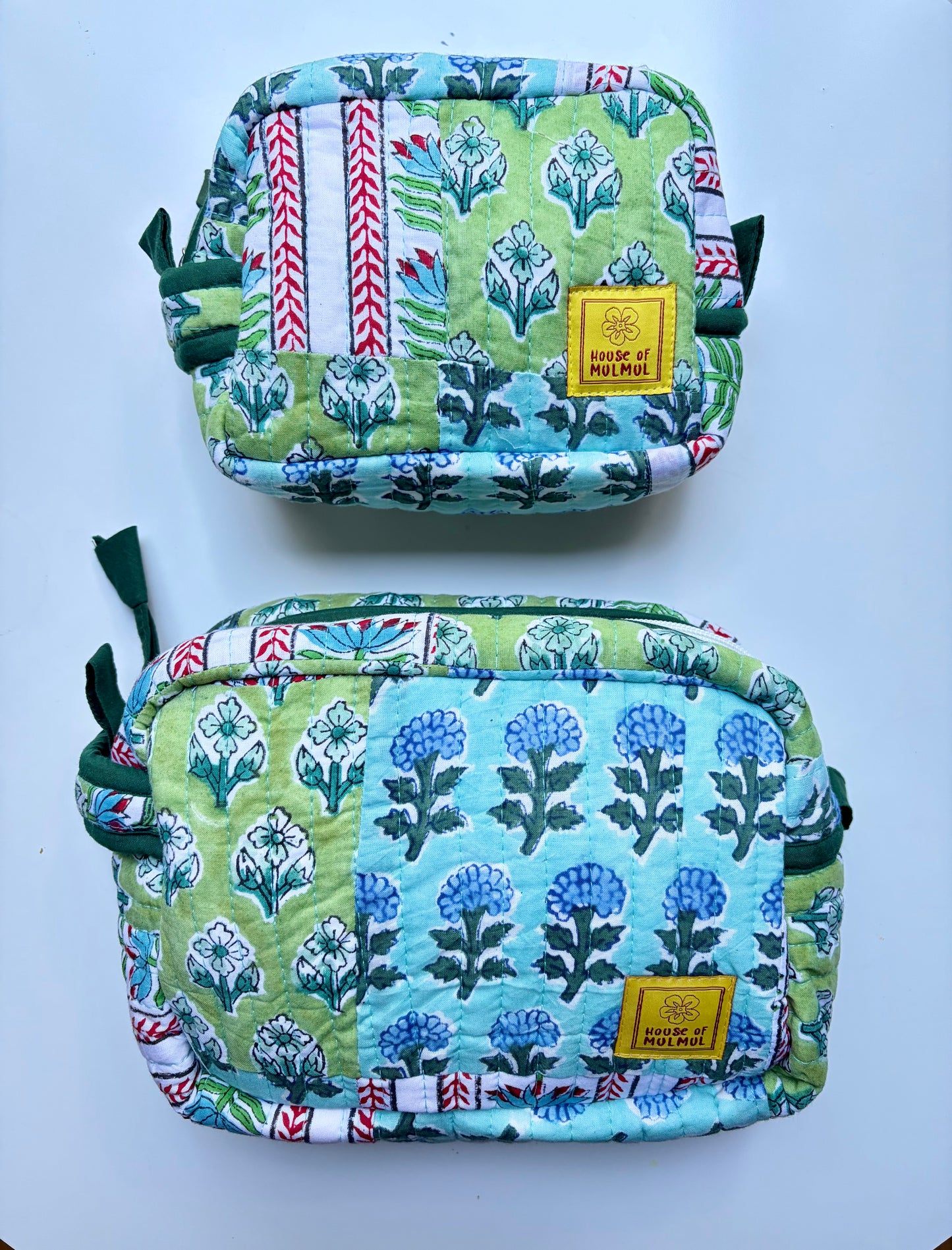 House of Mulmul - Handblock Printed Travel Makeup Quilted Pouch set. Two fabric pouches with floral patterns on a white background