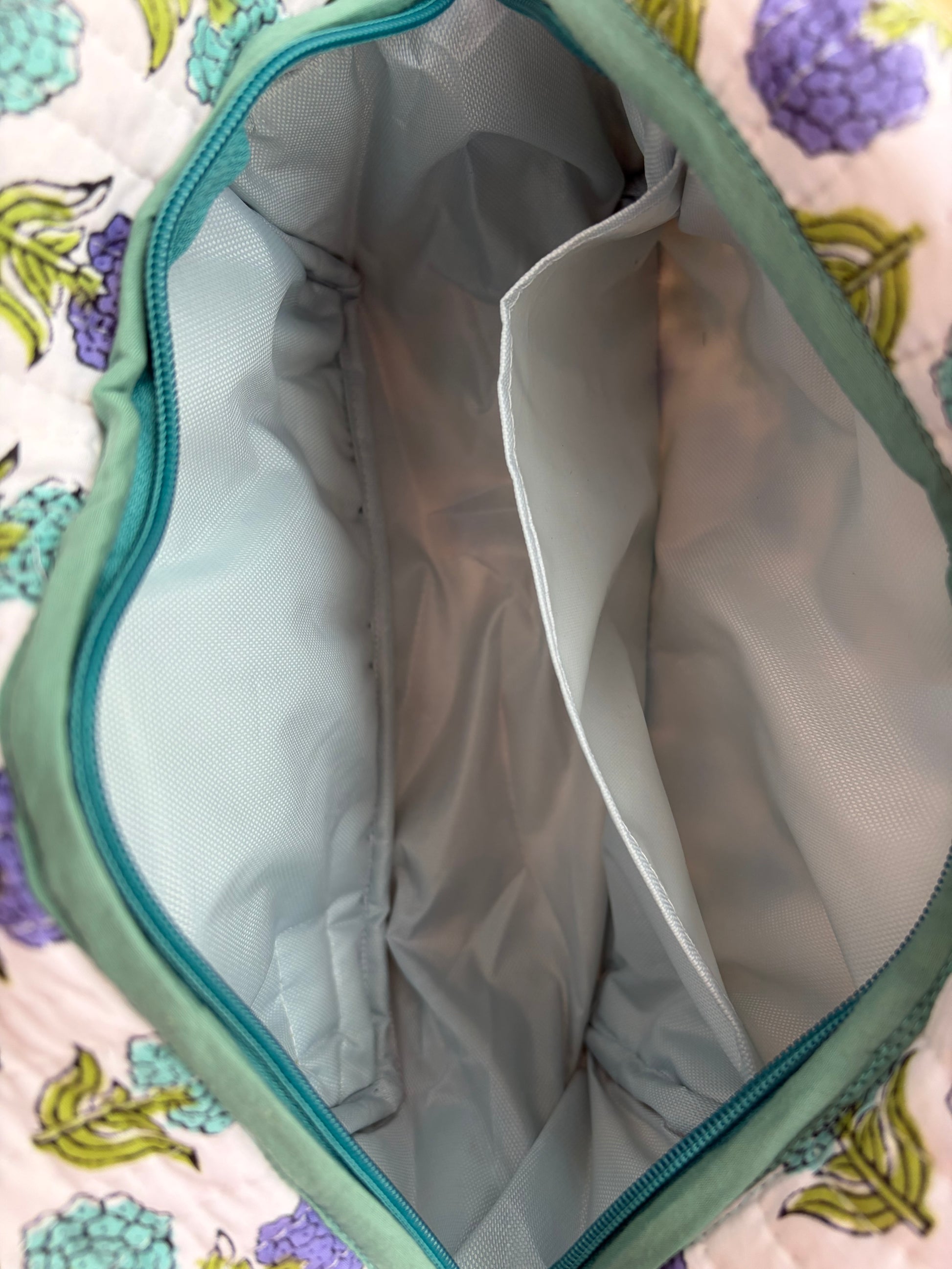 House of Mulmul - Quilted Blockprint Travel Makeup pouch. Inside of the makeup bag with plastic lining and pocket.