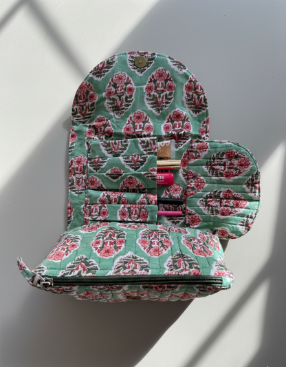 House of Mulmul - Quilted Foldable Travel Makeup pouch. Floral-patterned makeup case on a light gray background