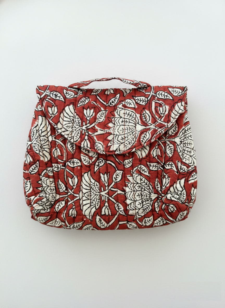House of Mulmul - Quilted Foldable Travel Makeup pouch. Red bag with white floral pattern on a white background