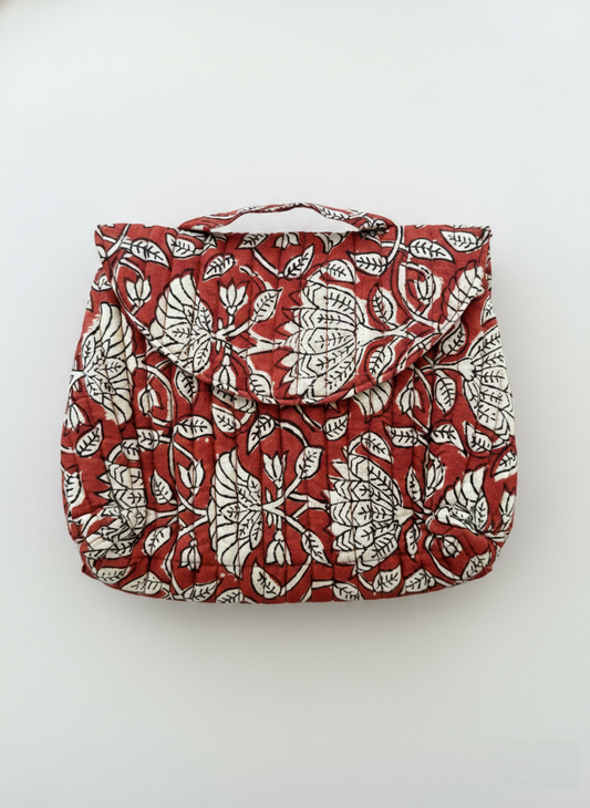 House of Mulmul - Quilted Foldable Travel Makeup pouch. Red bag with white floral pattern on a white background