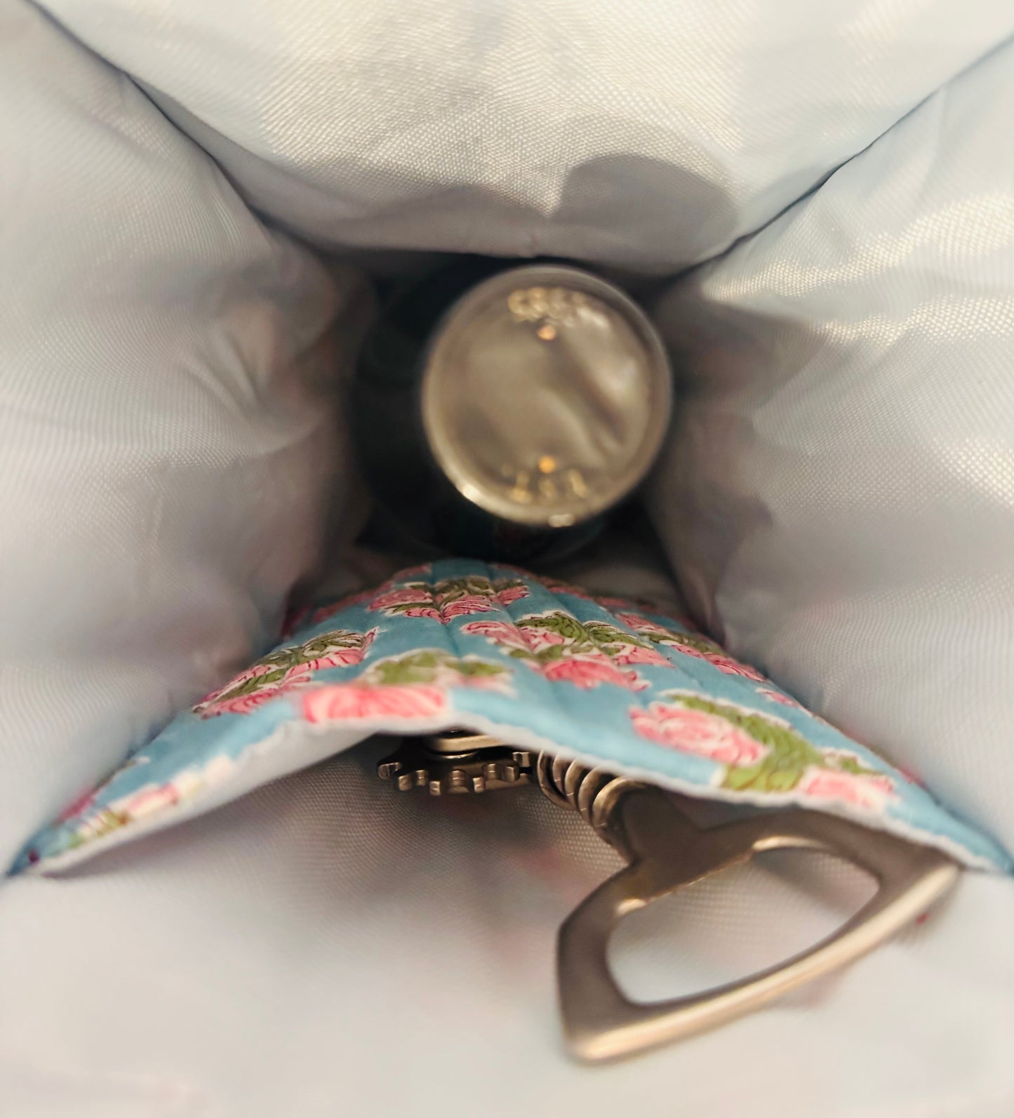 House of Mulmul - Quilted Wine Tote Bag. Bottle opener with floral design pouch on a light fabric background