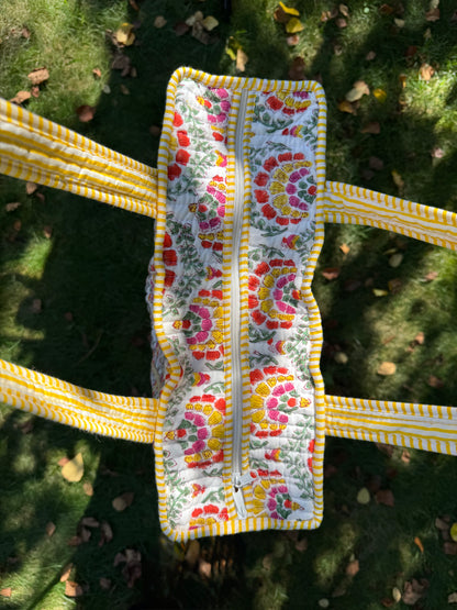 House of Mulmul - Cotton Tote Bag. Floral-patterned pouch with a zipper on a grassy background
