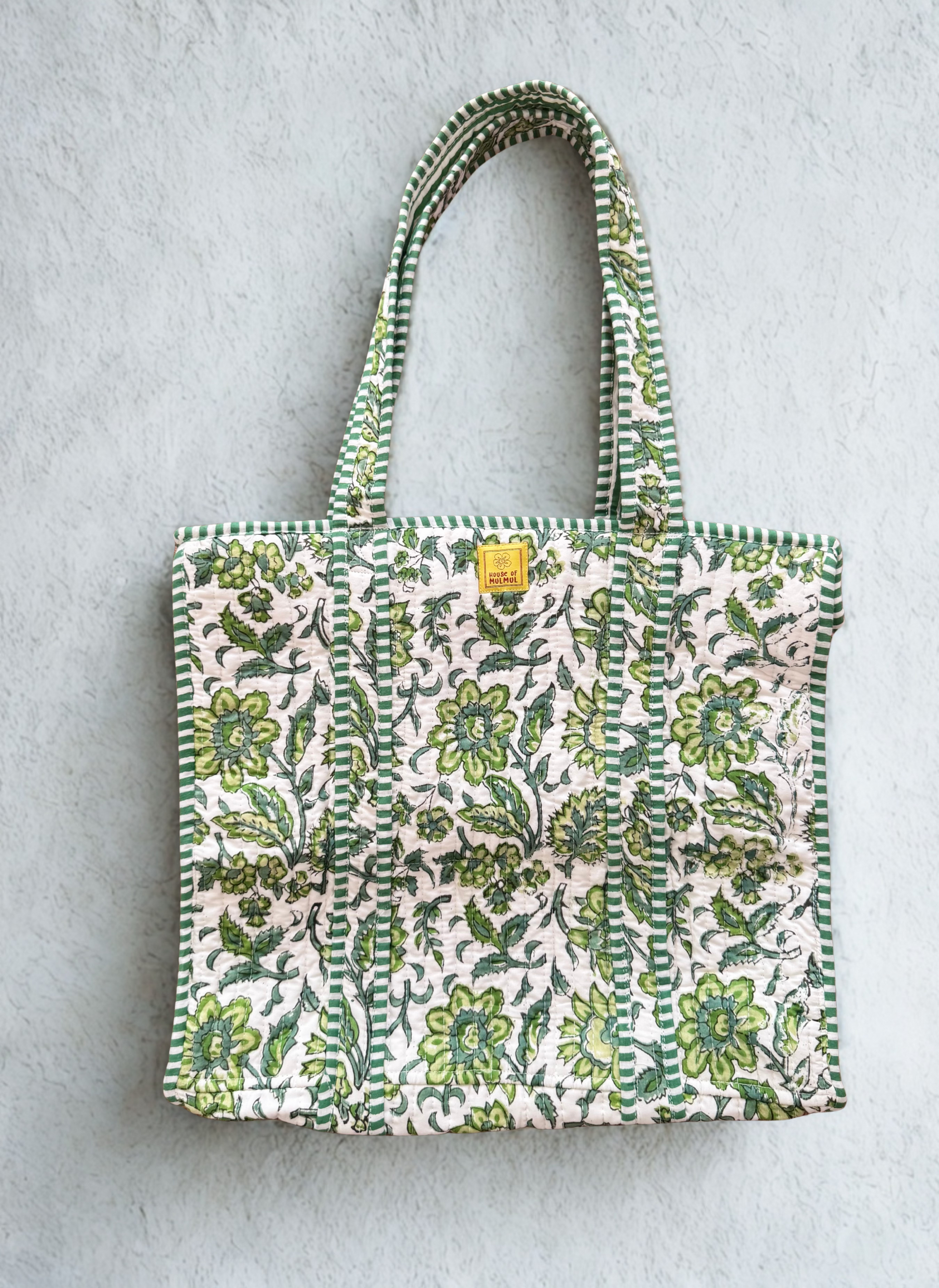 House of Mulmul - Cotton Tote Bag. Green Floral patterned tote bag on a light gray background