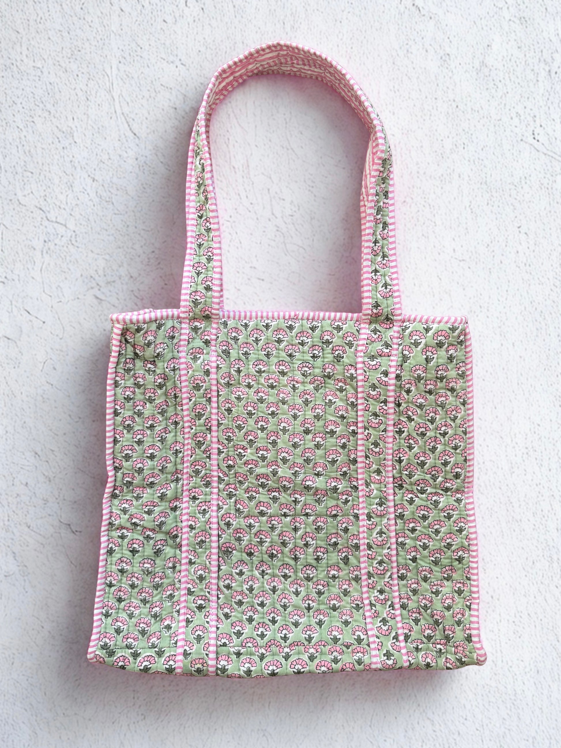 House of Mulmul - Cotton Tote Bag. Tote bag with pink and green pattern on a light gray background