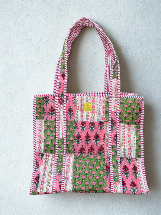 House of Mulmul - Cotton Tote Bag. Patterned tote bag with pink and green design on a light gray background