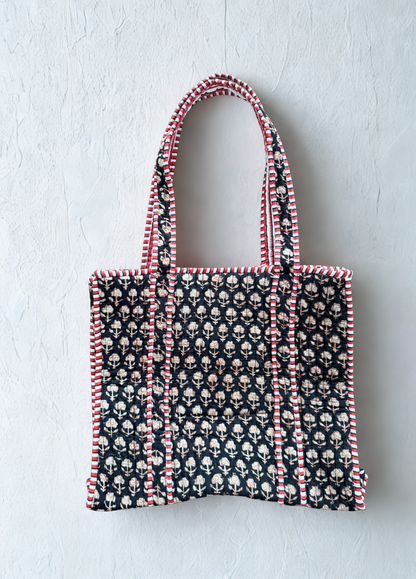 House of Mulmul - Cotton Tote Bag. Black Tote bag with pattern and red accents on a light gray background