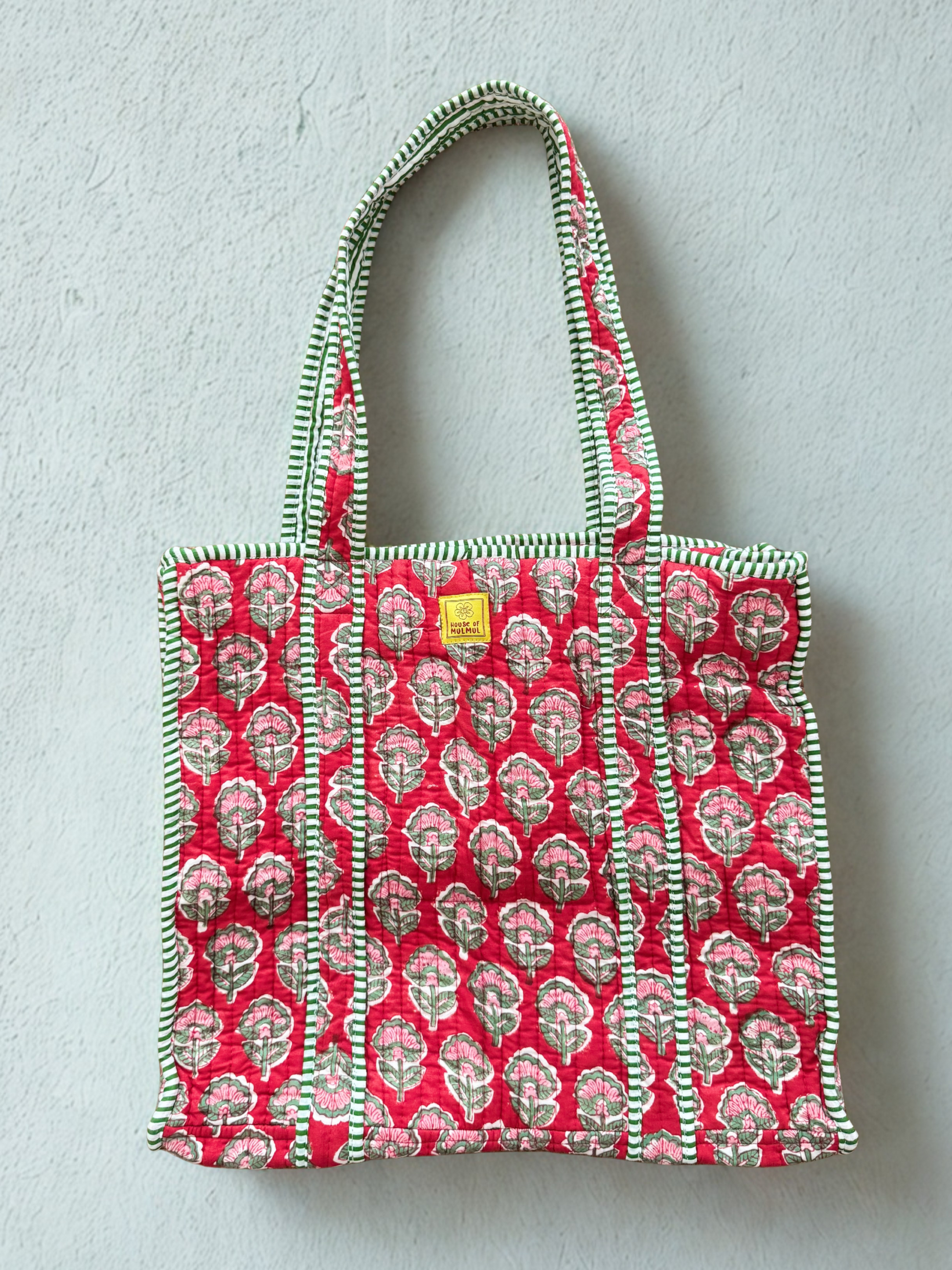 House of Mulmul - Cotton Tote Bag. Red Pink patterned tote bag with a visible brand label on a light gray background