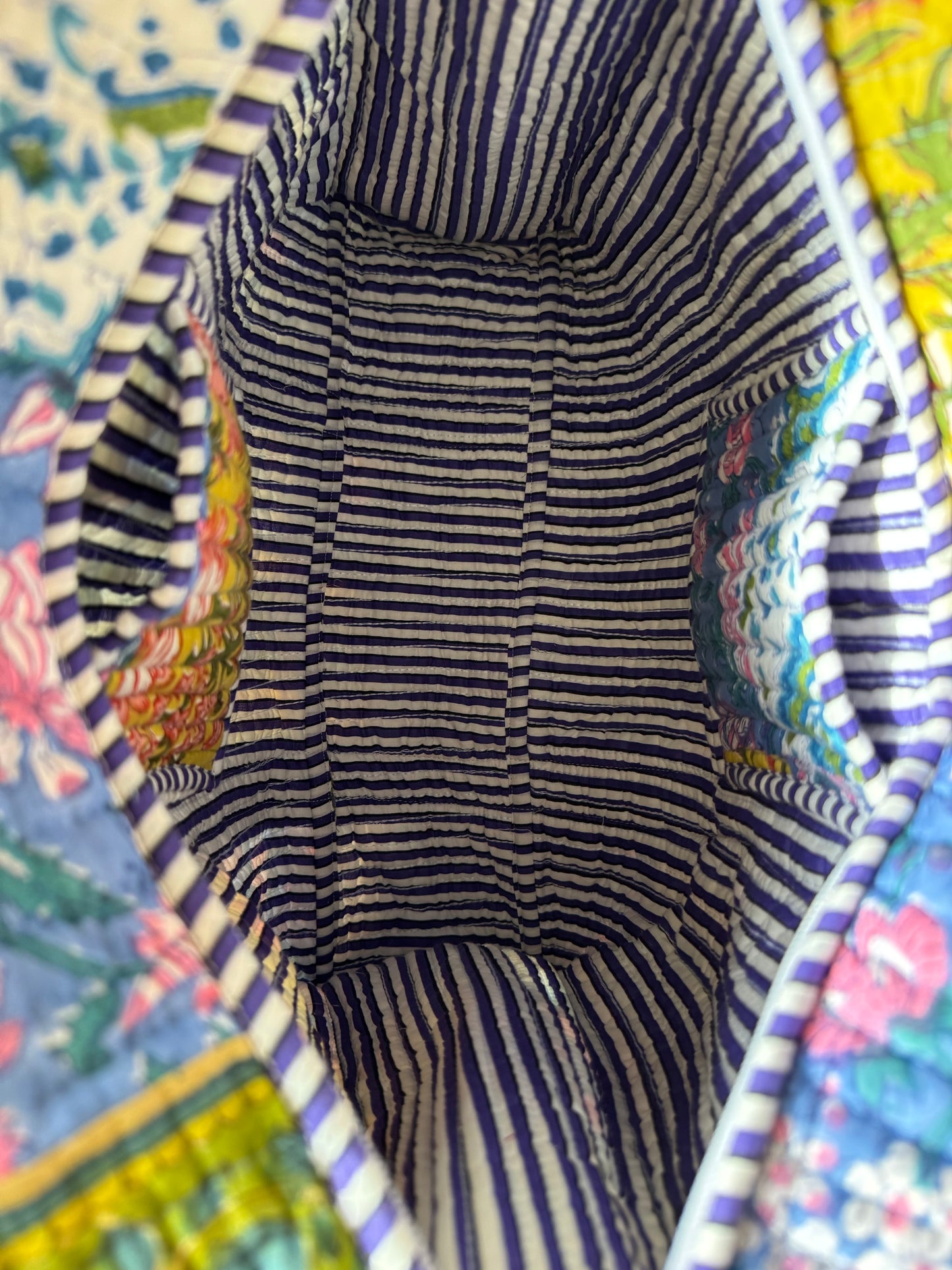 House of Mulmul - Cotton Tote Bag, Travel Bag. Striped fabric interior of a bag with pockets and colorful floral patterned fabric exterior