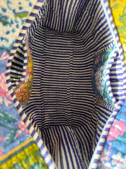 House of Mulmul - Cotton Tote Bag, Travel Bag. Striped fabric interior of a bag with pockets and colorful floral patterned fabric exterior