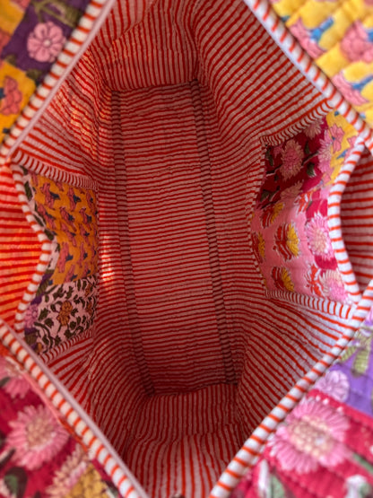 House of Mulmul - Cotton Tote Bag, Travel Bag. Close-up of a colorful fabric interior with pockets and striped pattern