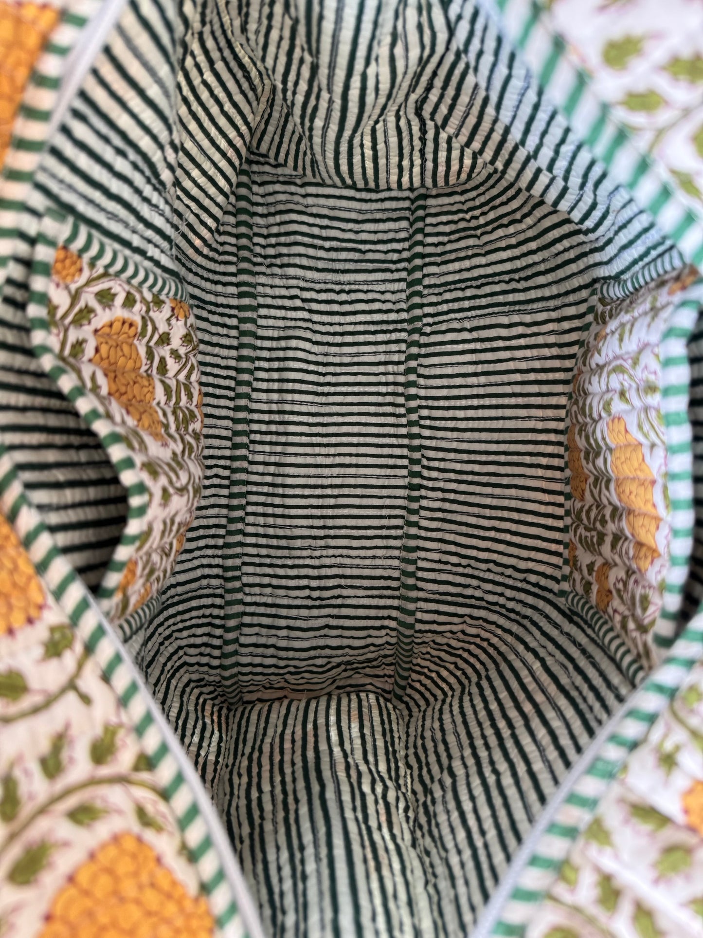 House of Mulmul - Cotton Tote Bag, Travel Bag. Close-up of a fabric interior with pockets and striped pattern and decorative edges