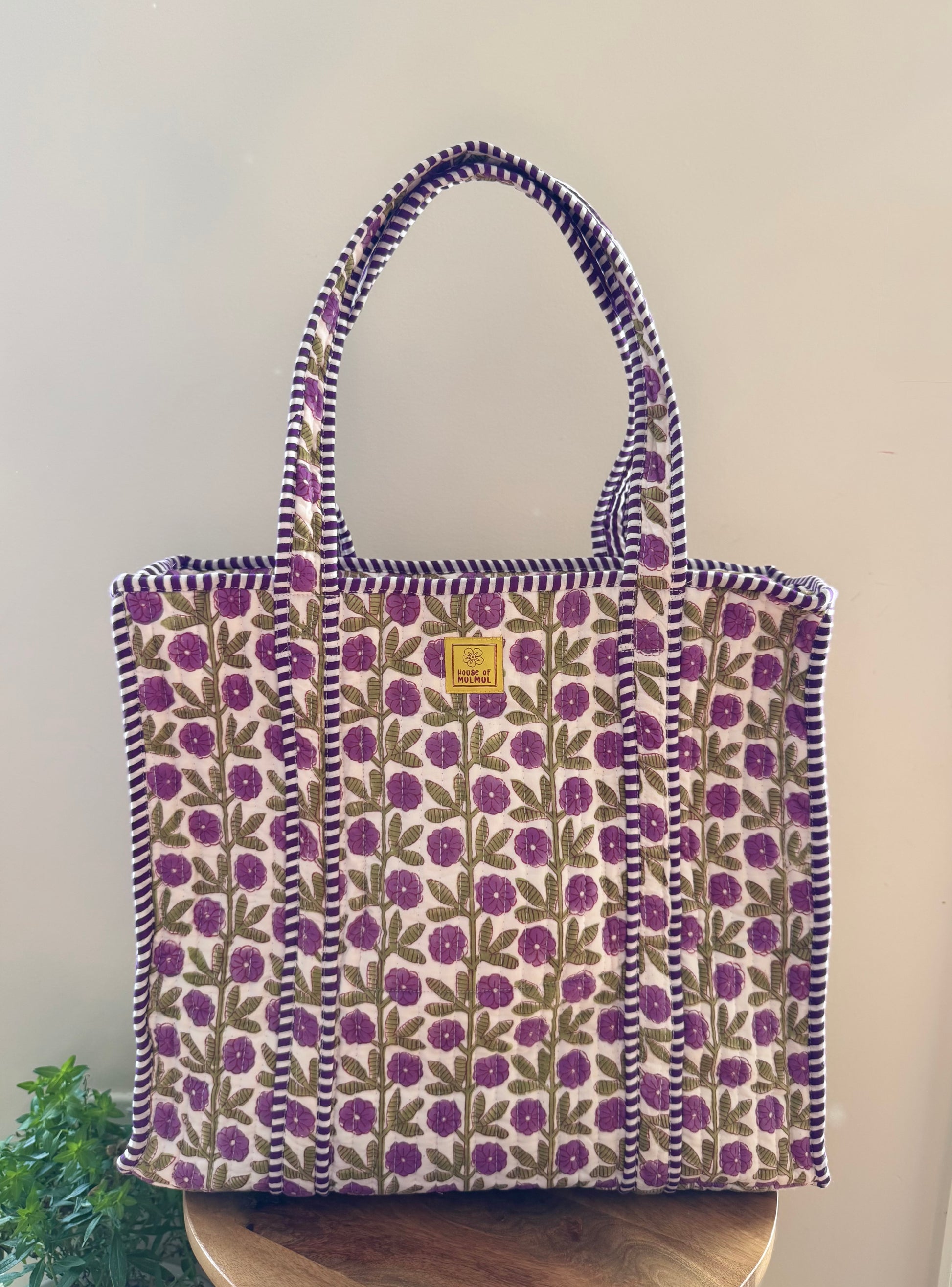 House of Mulmul - Cotton Tote Bag, Travel Bag. Floral patterned tote bag with purple flowers on a plain background